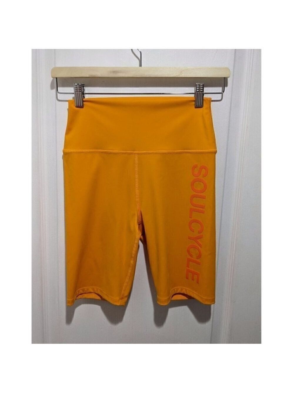 SoulCycle | Milestone High Rise logo Bike Short 8" in Orange